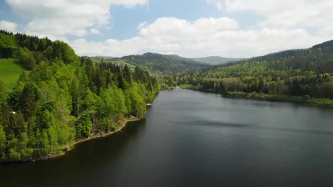 Drone shot view of green mountain and lake. Video stock 268897920
