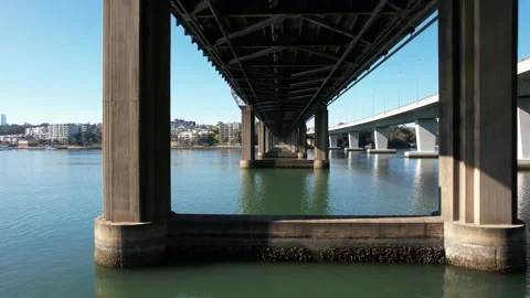 Drone-shot view under the Ryde Steel Bridge over the Parramatta River in Sydney, 스톡 동영상 220130010