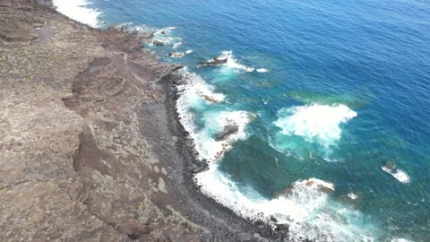Drone shot of volcanic cliffs on the coast of El Hierro Stock Footage 194161388