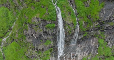 Drone shot of a waterfall in the mountains during Summer-2 Stock Footage 283568729