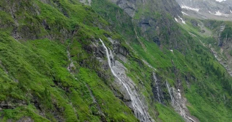 Drone shot of a waterfall in the mountains during Summer-4 Stock Footage 283569135