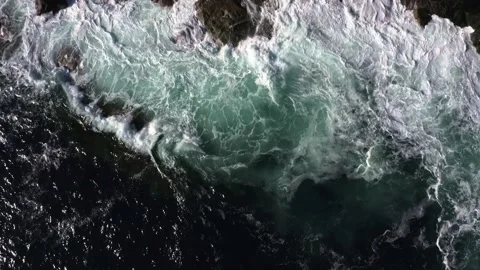 Drone shot of waves crashing into the rocks in Isle of Skye, Scotland. Stock Footage 201213161