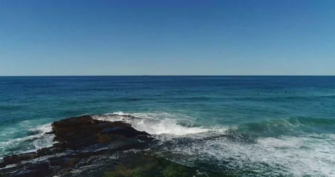 Drone Shot Waves Crushing against the rocks Stock Footage 115706485