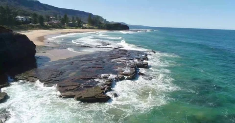 Drone Shot Waves Crushing against the rocks Stock Footage 115758343