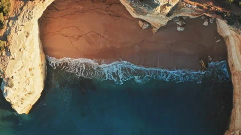 Drone shot of waves hitting the wild coast Stock Footage 203594640