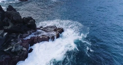 Drone shot of waves splashing on rocks. Shoreline of Canary island Stock Footage 83870023