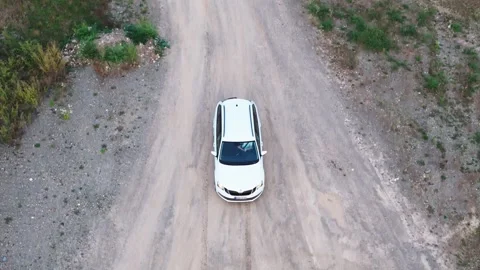 Drone Shot: White Car Splashes Through Puddle Stock Footage 285407505