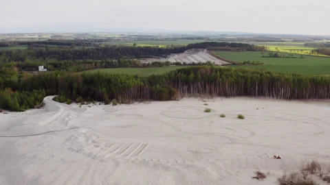 Drone shot of a white desert by the forest. Stock Footage 149112899