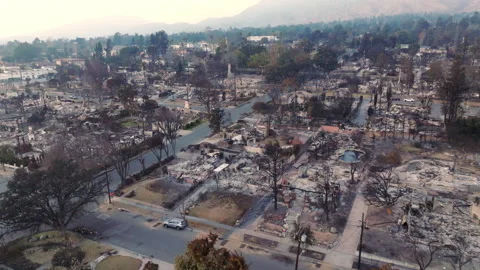 Drone shot of wildfire damage in Altadena neighborhood of Los Angeles Stock Footage 301645745