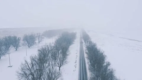 Drone shot of Wind and snow and road roads Stock Footage 233554433