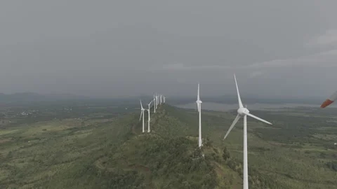 Drone shot of wind turbines spinning in the wind Stock Footage 302265645