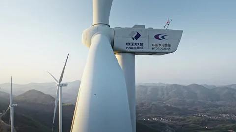 Drone Shot of Wind Turbines Turning . Wind Power, Alternative Energy 動画素材 324872277
