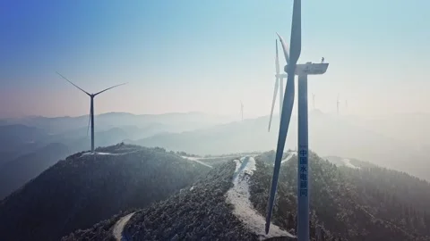Drone Shot of Wind Turbines Turning on a Mountain with a Sky Background. Stock Footage 326211628