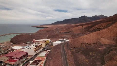 Drone Shot of Winding Road Through Fuerteventura Desert to Jandia Stock Footage 309696236