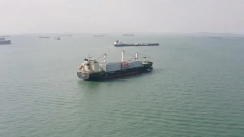 Drone shot of windmill blades on bulk carrier, Singapore Stock Footage 157572400