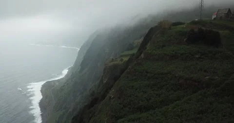 Drone shot of windy cliffs with clouds on Northern Madeira coast Clip 1 Stock Footage 140623327