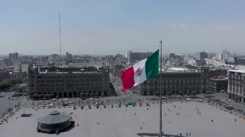 Drone Shot Wrapping Around Flag In Plaza De La Constitucion, Zocalo, Mexico City Stock Footage 154669040