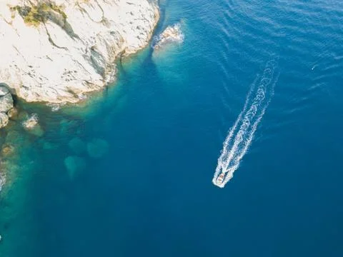 Drone shot of yacht and blue sea Stock Photos
