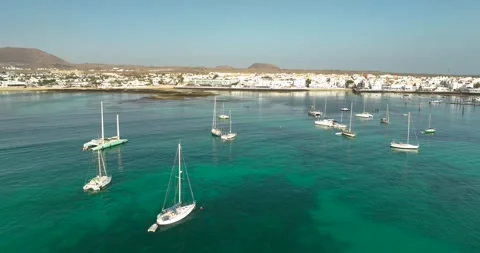 Drone shot of yachts moored close to a Spanish Holiday Resort Stock Footage 343621762