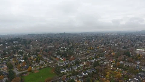 Drone shots come down from over town to over sea Stock Footage 127002206