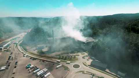 Drone shots of an fire due to an explosion in a garbage recycling station Stock Footage 156227081