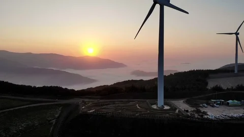 Drone shots of wind generators on top of a mountain Stock Footage 122974996