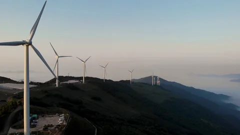 Drone shots of wind generators on top of a mountain Stock Footage 122975021