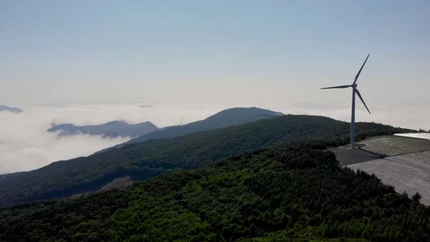 Drone shots of wind generators on top of a mountain Stock Footage 122975188