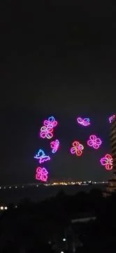 Drone show illuminating flowers and butterflies Stock-Fotos