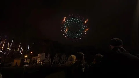 Drone Show Making a Circular Pattern Over Crowd at Night Stock Photos