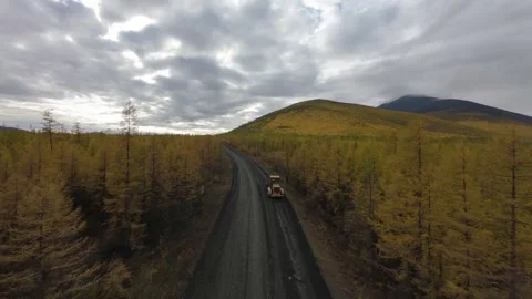 A drone showcases the efficient work of a road service team as they repair Stock Footage 287574943
