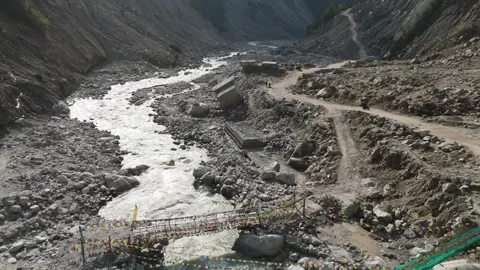 Drone showcasing rugged offroad trails beside the flowing Teesta River. Stock Footage 311389018