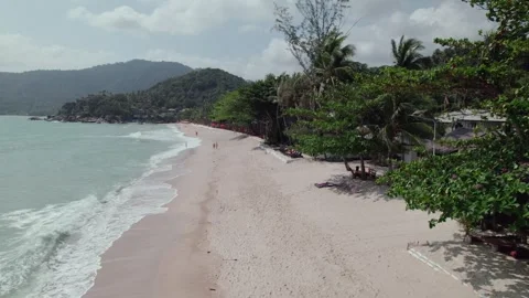 Drone showing Beach with Trees and coffeshop,Sunny Daytime,Koh Phangan,Thailand Stock Footage 279165622