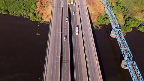 Drone shows freeway overpass spanning waterway Stock Footage 310289712