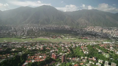 Drone shows Santa Sofía with hills and cityscape, Caracas Stock Footage 316903884