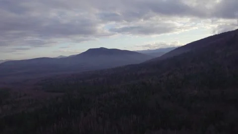 Drone Side Flight Over Mountain Slope and Layered Forested Hills Stock Footage 327205037