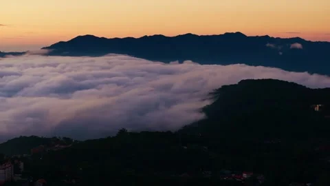 Drone side flight sunrise over eastern Baguio Benguet Philippines above clouds Vídeo Stock 331120106