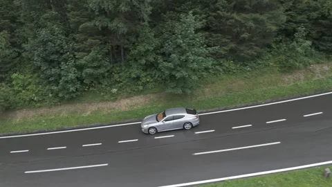 Drone Side View of Car Driving on Alpine Road Stock Footage 280307305