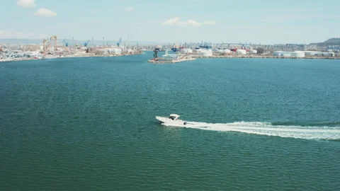 Drone side view of a white boat sailing to the blue sea.fishing on sea Stock Footage 238474833