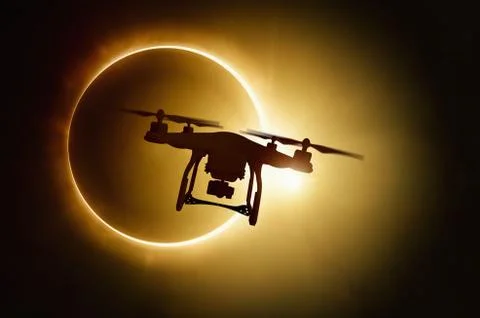 Drone silhouette on total solar eclipse background Фото