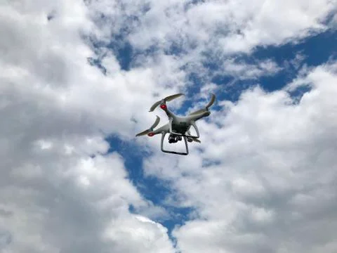 Drone in the sky with clouds. Stock Photos