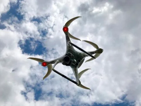 Drone in the sky with clouds. Stock Photos