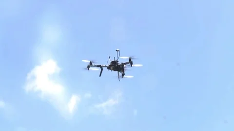 A drone in the sky. Quadrocopter. The drone. UFO. Flying camera. Stock Footage 84576649