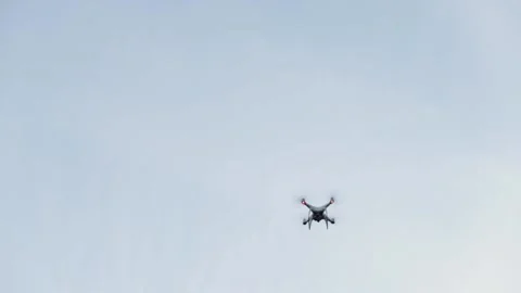 Drone in the sky, small quadrocopter flying, professional video gadget, digit Stock Footage 222527033