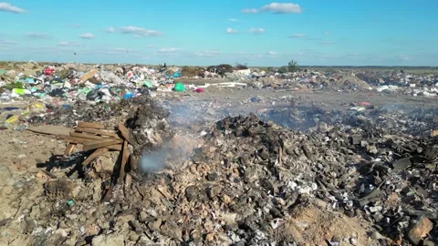 Drone sliding shot of burning garbage dump pollution, landfill Stock Footage 292658584