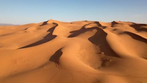 Drone slow forward flyover across Erg Chebbi sand dunes near Merzouga Morocco Stock Footage 339640169