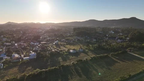 Drone slow motion aerial view of sunrise over the Atlantic Ocean in Garopaba Stock Footage 316358203