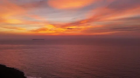 Drone slow motion aerial view of sunrise over the Atlantic Ocean in Garopaba Stock Footage 316361089