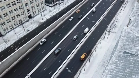 Drone slow motion along the road in snowy streets Stock-Footage 169071111