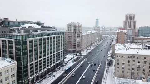Drone slow motion along the road in snowy streets Stock-Footage 169071276